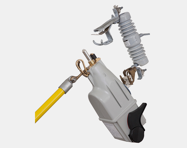 right side profile of a trip saver lateral fuse cutout opened using a yellow hookstick Handling Tools, lateral fuse cutout, trip saver, lateral fuse