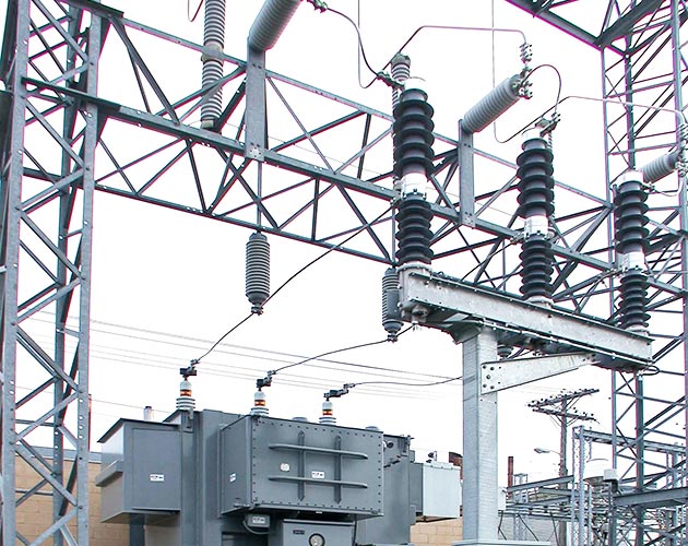 Trans Rupter II Transformer Protector installed in a substation with gray skies above Trans-Rupter II Transformer Protector, transformer protector, overhead switchgear, distributions